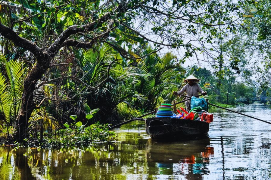 Local life in the Mekong Delta, an authentic cultural experience on the 8 Days Vietnam itinerary from Hanoi to Ho Chi Minh.