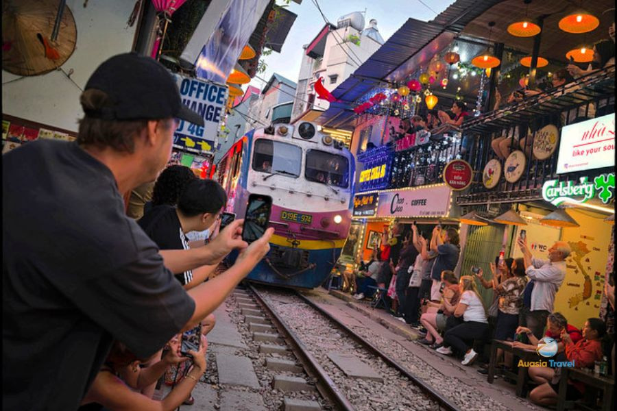 Hanoi Train Street with tourists and local life in Vietnam.